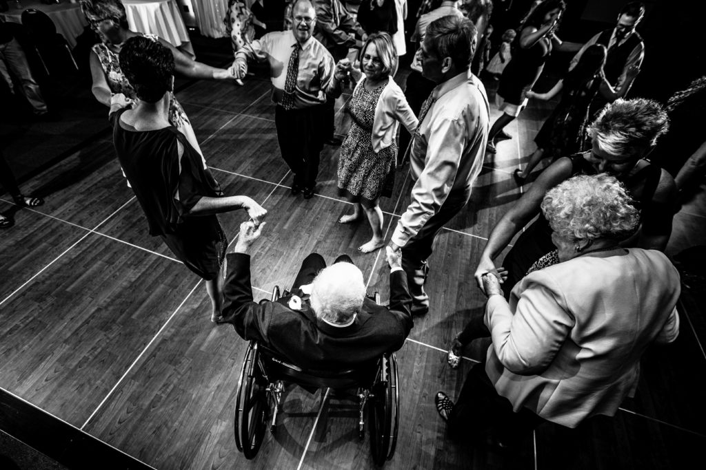 best candid photo - quad cities wedding photographer - wedding photographer quad cities - grandpa dancing in wheel chair