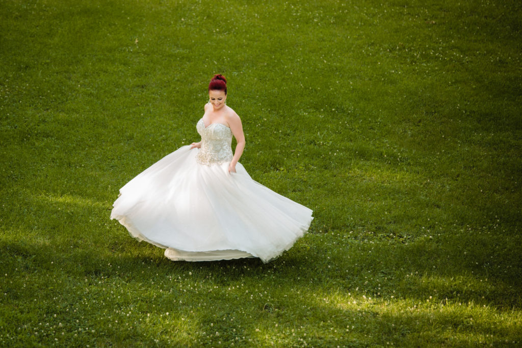 Bride dancing in dress - Quad Cities wedding - Cadenza Photo Imaging - Black Hawk State Park Weddings